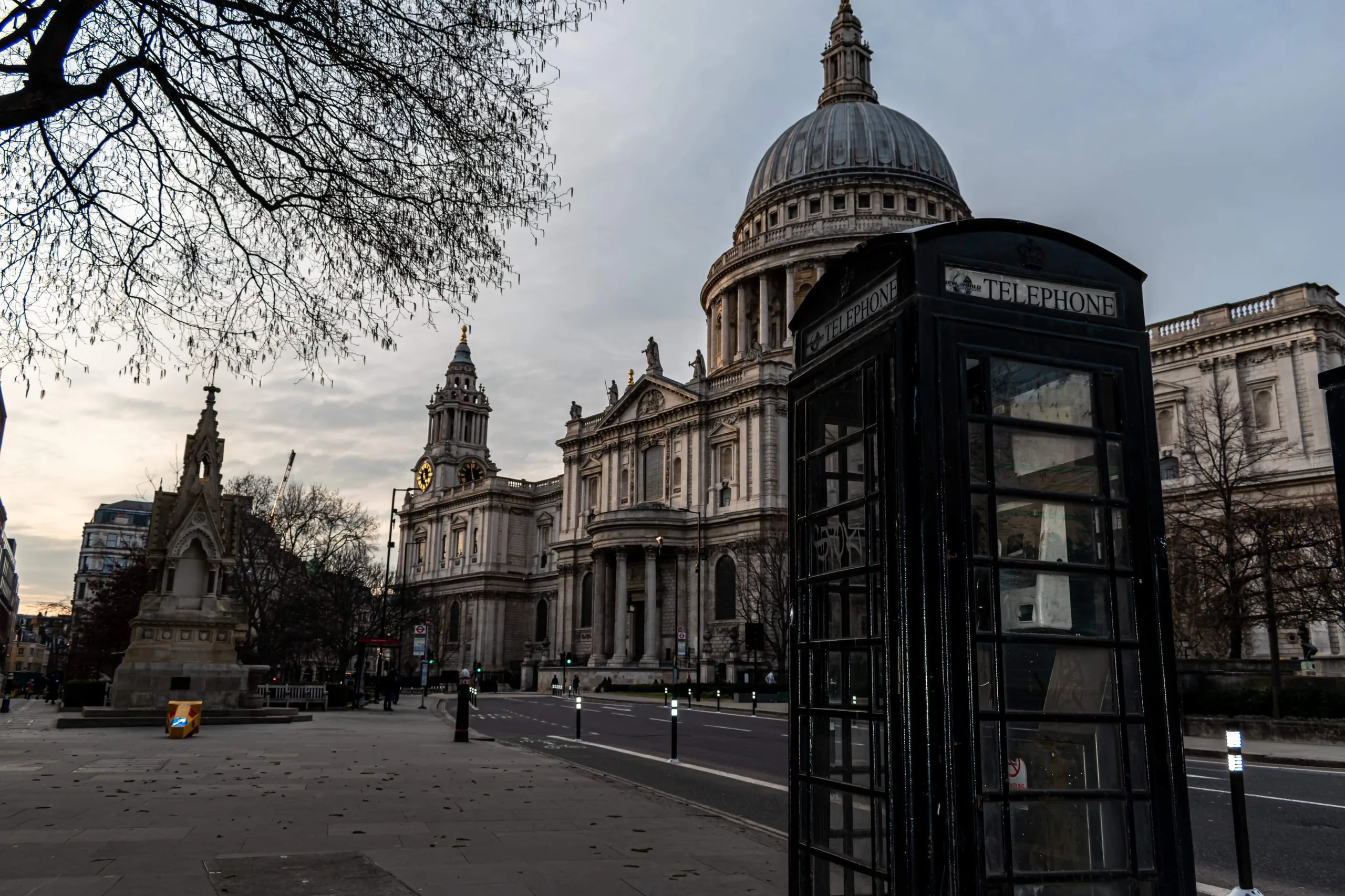 St Paul’s Cathedral at dusk beside a black London telephone box